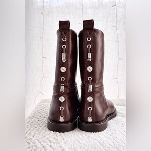 Brown Leather Boots with Decorative Lacing
Worn once